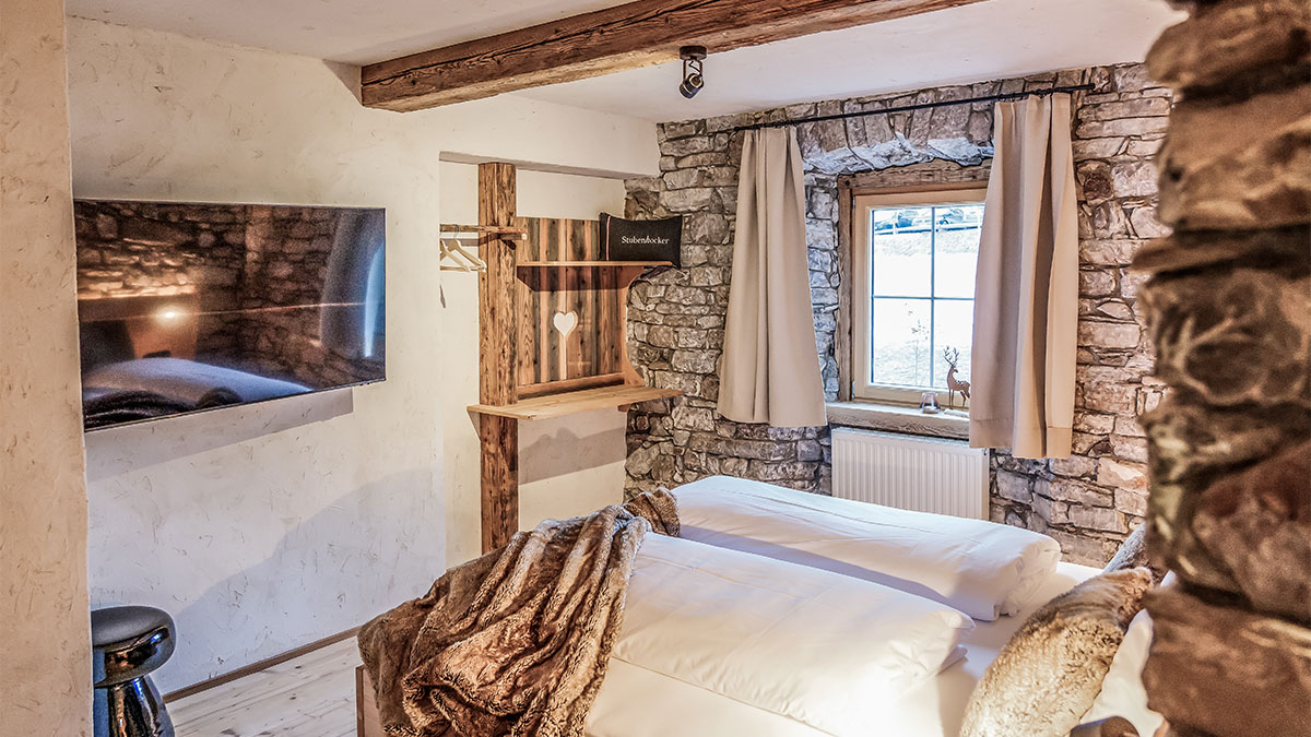 Schlafzimmer in der Benglerwald Lodge